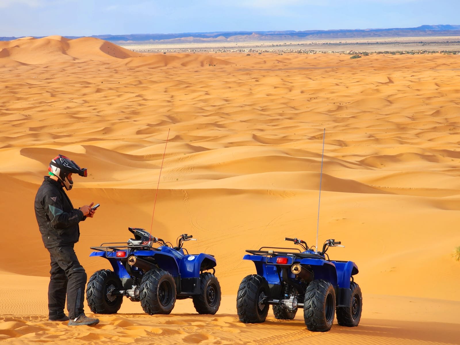 Quad bike ride through desert dunes