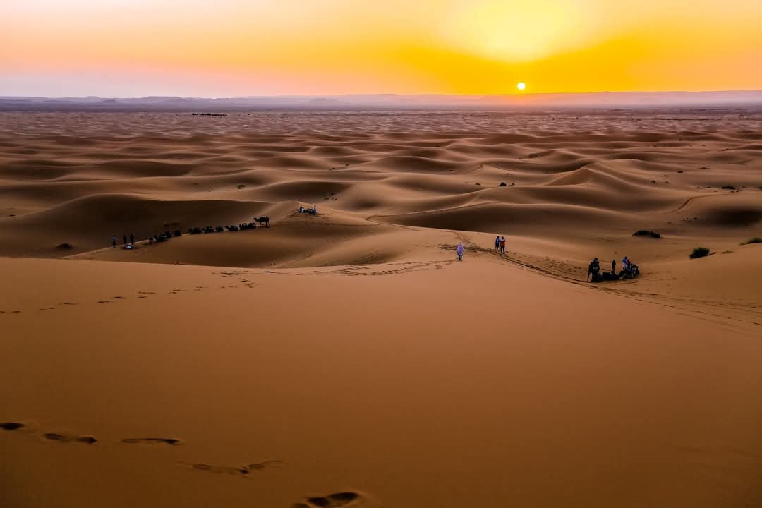 Sunset over Sahara Desert sand dunes in Morocco