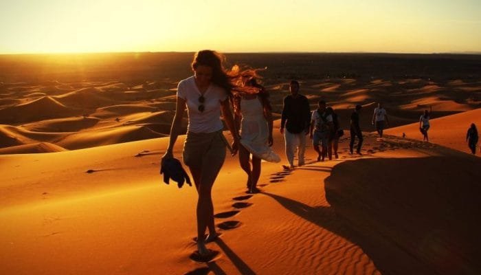 GettyImages-974794734_Morocco_Desert_Sunset_Walk-e1563237463247